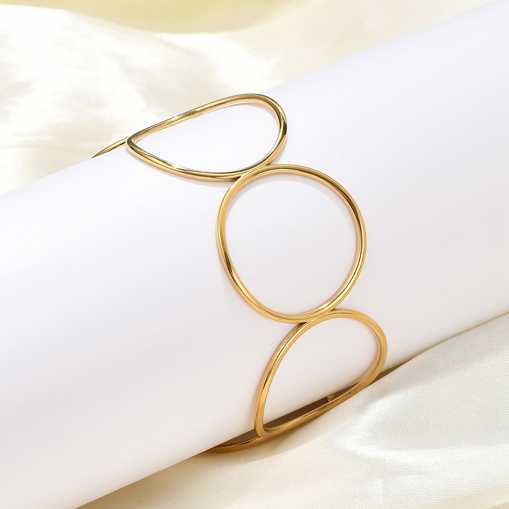 Brazalete Círculos de Acero Inoxidable. Bañados en Oro Real de 18K — foto 3